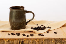 Load image into Gallery viewer, Brown ceramic mug with carvings
